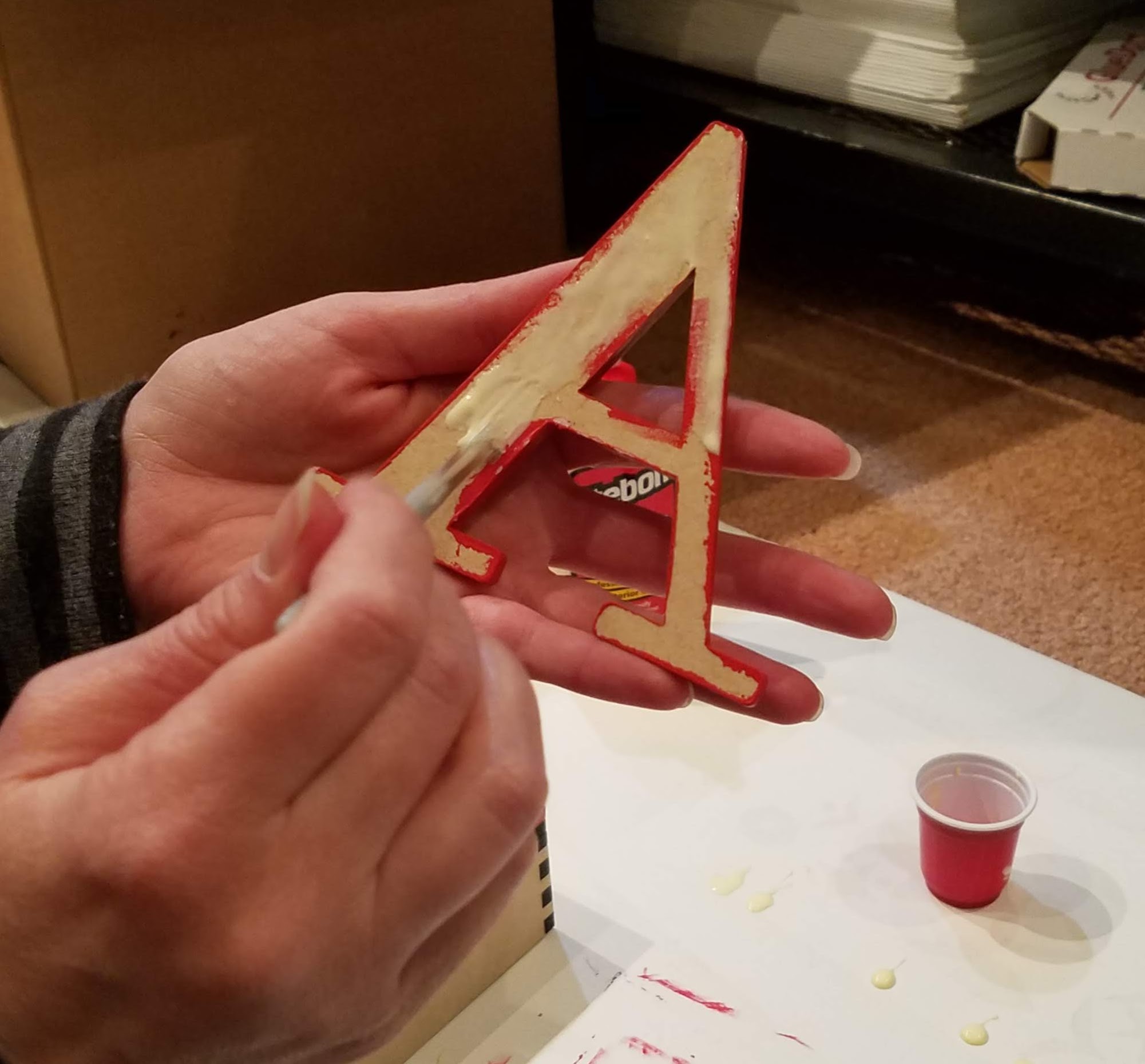 Painting glue on letter Living Lullaby Designs